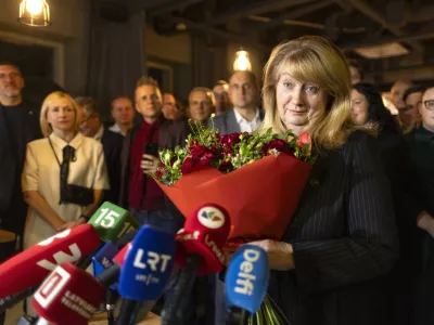 Leader of the Social Democratic Party Vilija Blinkeviciute speaks to the media while waiting for the results of the second round of Lithuania's parliamentary election, in an office in Vilnius, Lithuania, Sunday, Oct. 27, 2024. (AP Photo/Mindaugas Kulbis)