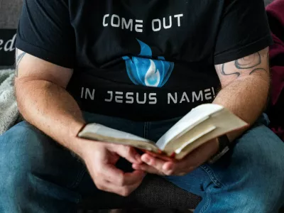 A member of Pastor Greg Locke's Global Vision Bible Church reads his Bible during church service in Mount Juliet, Tennessee, U.S. October 27, 2024. REUTERS/Seth Herald