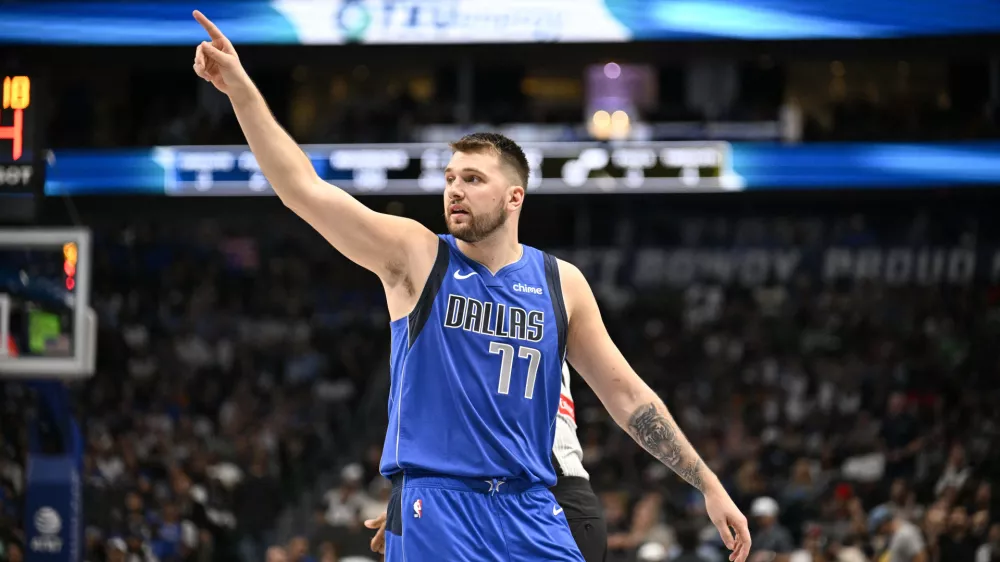 Oct 28, 2024; Dallas, Texas, USA; Dallas Mavericks guard Luka Doncic (77) motions to his teammates during the second half against the Utah Jazz at the American Airlines Center. Mandatory Credit: Jerome Miron-Imagn Images