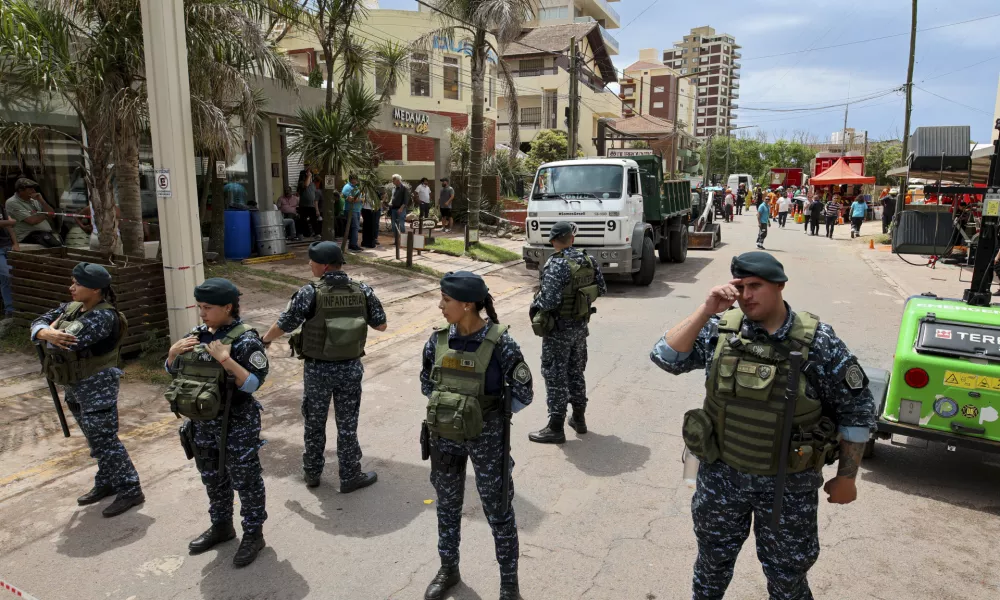 Police block a street leading to the Dubrovnik Hotel where firefighters and rescuers work to find survivors after the hotel collapsed, in Villa Gesell, Argentina, Tuesday, Oct. 29, 2024. (AP Photo/Christian Heit)