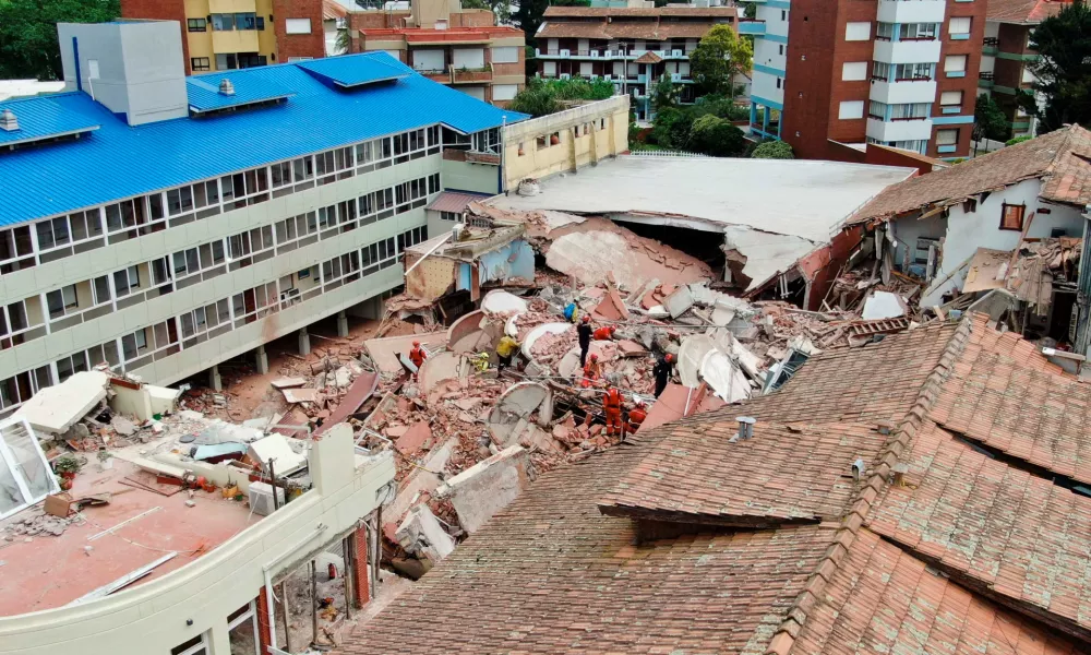 A drone view shows rescue workers searching for victims amidst the remains of the hotel Dubrovnik, after it collapsed, in the coastal city of Villa Gesell, Buenos Aires, Argentina October 29, 2024. REUTERS/Pablo Funes