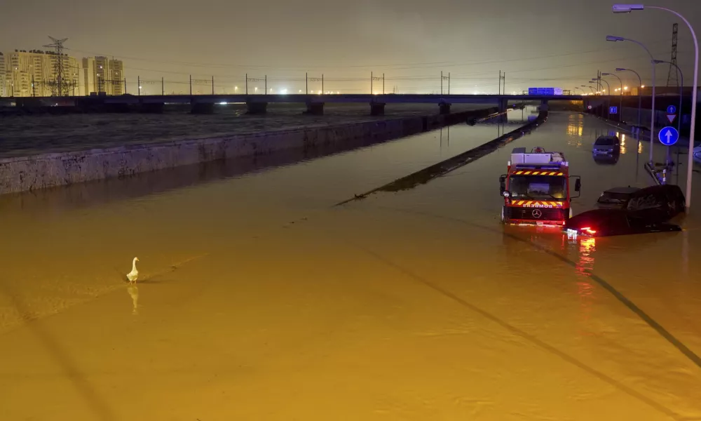 Cars are trapped by flooding in Valencia, Wednesday, Oct. 30, 2024. (AP Photo/Alberto Saiz)