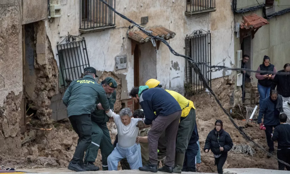 Members of emergency services and Guardia Civil rescue people trapped in their homes after floods in Letur, Albacete, Tuesday, Oct. 29, 2024. (Víctor Fernández/Europa Press via AP)