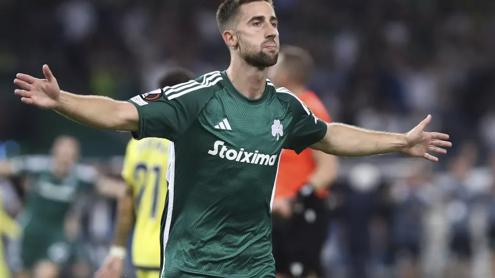 Panathinaikos's Andraz Sporar celebrates after scoring against Villarreal during the Europa League group F soccer match between Panathinaikos and Villarreal at Spyros Louis stadium in Athens, Thursday, Sept. 21, 2023. (Stelios Olitakis/InTime Sports via AP)