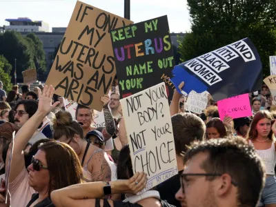 FILE - Protesters rally at the Ohio Statehouse in support of abortion rights after the U.S. Supreme Court overturned Roe vs. Wade, June 24, 2022, in Columbus, Ohio. Ohio's constitution is caught in a tug-of-war. With an effort to enshrine abortion rights looming this fall, an influential mix of Republican politicians, lobbying organizations and business interests is working to make another change to the state's founding document first. They are pushing an amendment raising the threshold for passing future constitutional changes to 60% of Ohio voters from 50%-plus-one. (Barbara J. Perenic/The Columbus Dispatch via AP, File)