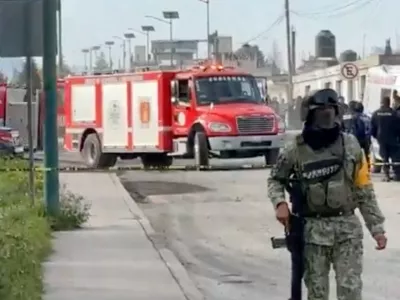 A firefighter's vehicle is driven near a member of the Mexican Army, after an explosion at a Simec-owned steel plant in Mexico's central Tlaxcala state, at San Cosme Xaloztoc, Tlaxcala state, Mexico, October 30, 2024, in this screengrab from a handout video. PRENSA DE TLAXCALA/Handout via REUTERS. THIS IMAGE HAS BEEN SUPPLIED BY A THIRD PARTY.NO RESALES. NO ARCHIVES. MANDATORY CREDIT