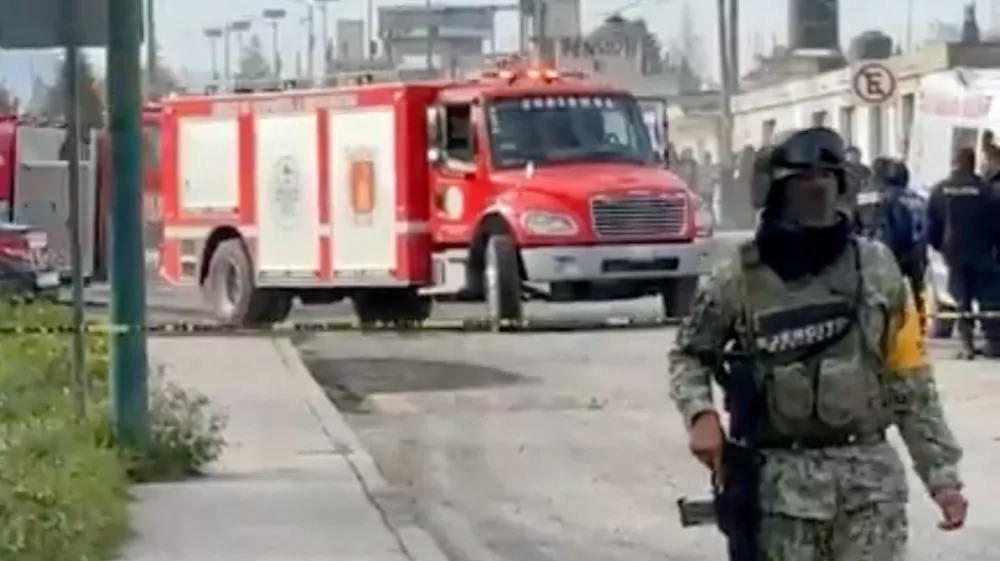 A firefighter's vehicle is driven near a member of the Mexican Army, after an explosion at a Simec-owned steel plant in Mexico's central Tlaxcala state, at San Cosme Xaloztoc, Tlaxcala state, Mexico, October 30, 2024, in this screengrab from a handout video. PRENSA DE TLAXCALA/Handout via REUTERS. THIS IMAGE HAS BEEN SUPPLIED BY A THIRD PARTY.NO RESALES. NO ARCHIVES. MANDATORY CREDIT