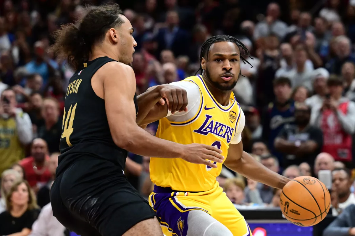 Oct 30, 2024; Cleveland, Ohio, USA; Los Angeles Lakers guard Bronny James (9) drives to the basket against Cleveland Cavaliers forward Jaylon Tyson (24) during the second half at Rocket Mortgage FieldHouse. Mandatory Credit: Ken Blaze-Imagn Images