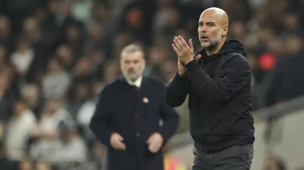 Manchester City's head coach Pep Guardiola reacts during the English League Cup fourth round soccer match between Tottenham and Manchester City, at the Tottenham Hotspur Stadium in London, Wednesday, Oct 30, 2024. (AP Photo/Ian Walton)