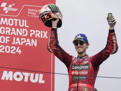 First place Italian rider Francesco Bagnaia of Ducati Lenovo Team celebrates during awards ceremony for the MotoGP race at the Twin Ring Motegi circuit in Motegi, north of Tokyo, Japan, Sunday, Oct. 6, 2024, (AP Photo/Hiro Komae)