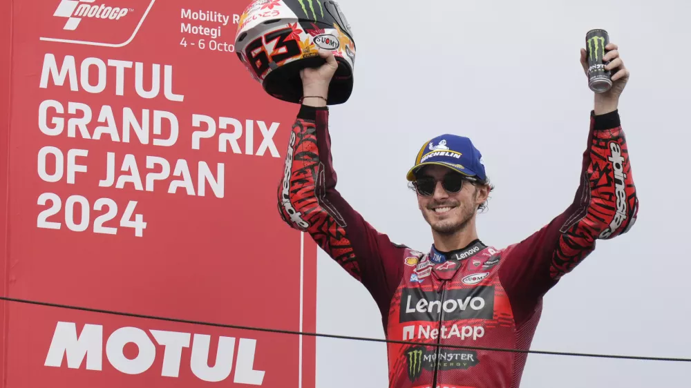 First place Italian rider Francesco Bagnaia of Ducati Lenovo Team celebrates during awards ceremony for the MotoGP race at the Twin Ring Motegi circuit in Motegi, north of Tokyo, Japan, Sunday, Oct. 6, 2024, (AP Photo/Hiro Komae)