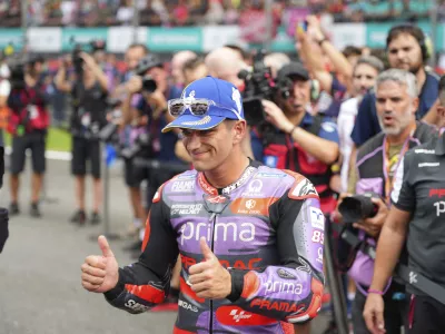 Spanish rider Jorge Martin of Prima Pramac Racing reacts after winning the sprint race at Sepang International Circuit ahead of MotoGP race in Sepang, outskirts of Kuala Lumpur, Saturday, Nov. 2, 2024. (AP Photo/Vincent Thian)