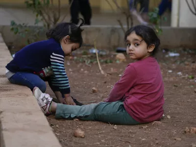 Displaced children, who fled Baalbek city and the nearby towns of Douris and Ain Bourday with their families amid the ongoing Hezbollah-Israel war, play inside a school being used as a shelter, in Deir Al-Ahmar, east Lebanon, Thursday, Oct. 31, 2024. (AP Photo/Hassan Ammar)