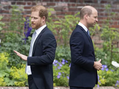 FILE - Prince Harry, left, and Prince William stand together during the unveiling of a statue they commissioned of their mother Princess Diana, on what would have been her 60th birthday, in the Sunken Garden at Kensington Palace, London, Thursday July 1, 2021. Prince Harry has said he wants to have his father and brother back and that he wants "a family, not an institution," during a TV interview ahead of the publication of his memoir. The interview with Britain's ITV channel is due to be released this Sunday. (Dominic Lipinski /Pool Photo via AP, File)