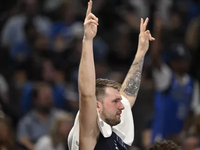 Nov 3, 2024; Dallas, Texas, USA; Dallas Mavericks guard Luka Doncic (77) celebrates from the team bench during the second half against the Orlando Magic at the American Airlines Center. Mandatory Credit: Jerome Miron-Imagn Images