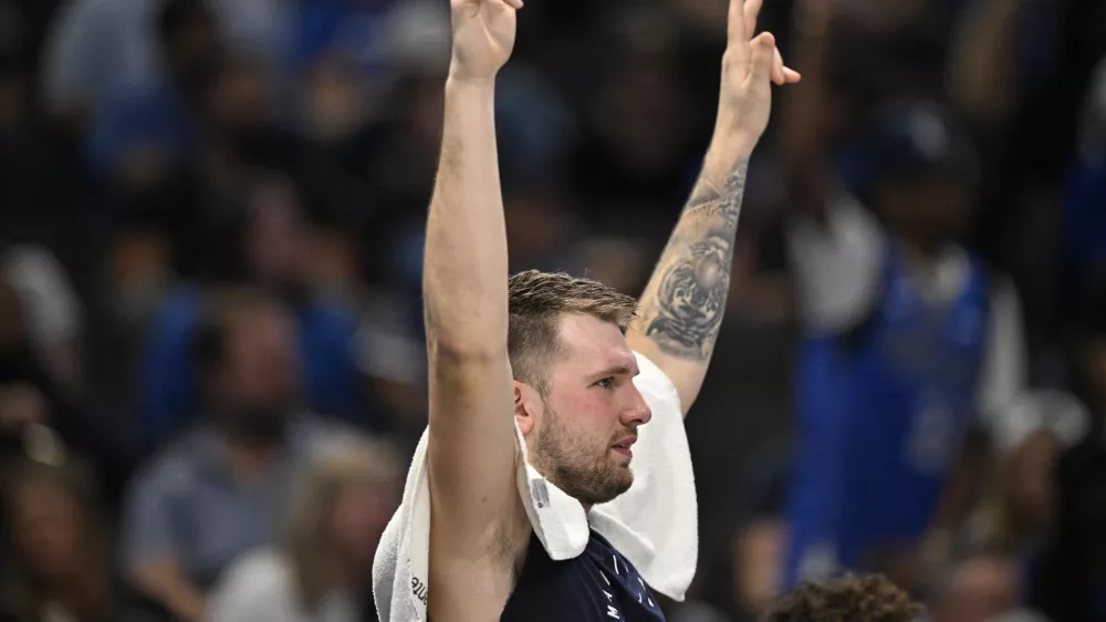 Nov 3, 2024; Dallas, Texas, USA; Dallas Mavericks guard Luka Doncic (77) celebrates from the team bench during the second half against the Orlando Magic at the American Airlines Center. Mandatory Credit: Jerome Miron-Imagn Images