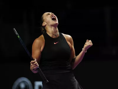 Tennis - WTA Finals - King Saud University Indoor Arena, Riyadh, Saudi Arabia - November 4, 2024 Belarus' Aryna Sabalenka reacts during her women's singles group stage match against Italy's Jasmine Paolini REUTERS/Hamad I Mohammed