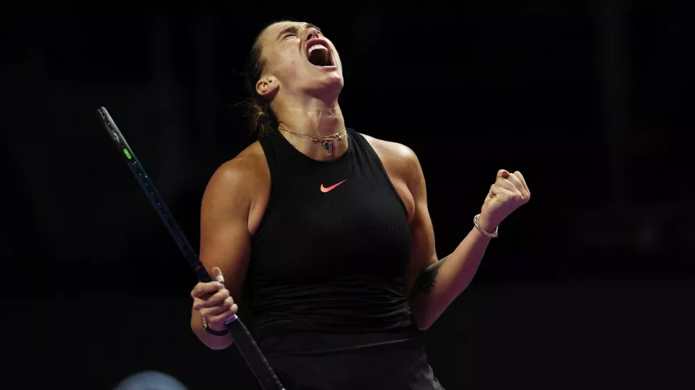 Tennis - WTA Finals - King Saud University Indoor Arena, Riyadh, Saudi Arabia - November 4, 2024 Belarus' Aryna Sabalenka reacts during her women's singles group stage match against Italy's Jasmine Paolini REUTERS/Hamad I Mohammed