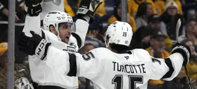 Los Angeles Kings center Anze Kopitar, left, celebrates with Alex Turcotte (15) after scoring against the Nashville Predators during the first period of an NHL hockey game Monday, Nov. 4, 2024, in Nashville, Tenn. (AP Photo/Mark Humphrey)