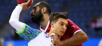 IHF Handball World Championship - Main Round - Iran v Slovenia - Tauron Arena, Krakow, Poland - January 18, 2023 Slovenia's Domen Makuc in action with Iran's Ali Kouhzad REUTERS/Tomasz Markowski