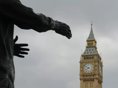 The Big Ben clock tower is pictured behind a sculpture in London May 7, 2010. The Conservatives were in pole position to take power on Friday after winning the most seats in parliament in a bitterly fought election and securing the tentative backing of the the Liberal Democrats. REUTERS/Toby Melville (BRITAIN - Tags: ELECTIONS POLITICS)