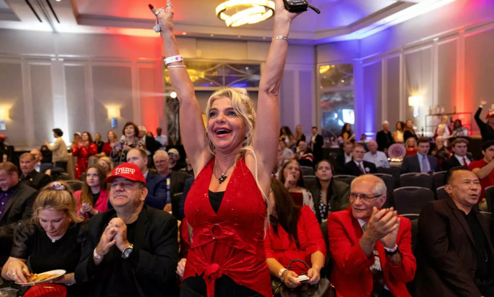 Supporters of Republican presidential nominee and former U.S. President Donald Trump react as they watch early election results at a 2024 U.S. Presidential Election Night Watch Party, in Atlanta, Georgia, U.S., November 5, 2024. REUTERS/Eloisa Lopez