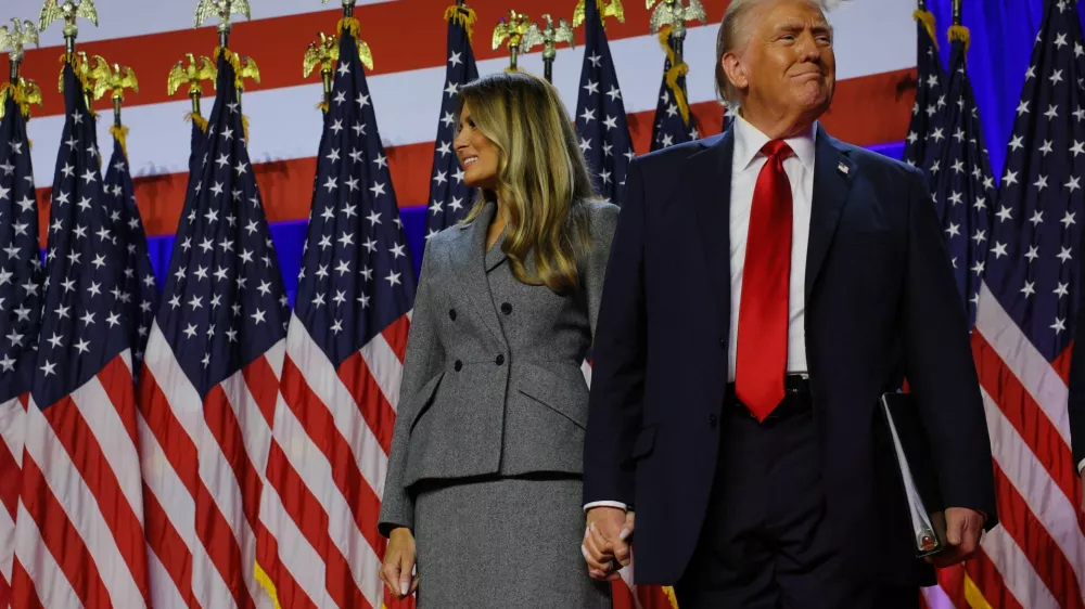 Republican presidential nominee and former U.S. President Donald Trump takes the stage with his wife Melania to address supporters at his rally, at the Palm Beach County Convention Center in West Palm Beach, Florida, U.S., November 6, 2024. REUTERS/Brian Snyder