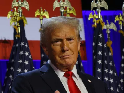 Republican presidential nominee and former U.S. President Donald Trump gestures as he stand on stage at his rally, at the Palm Beach County Convention Center in West Palm Beach, Florida, U.S., November 6, 2024. REUTERS/Brian Snyder