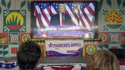 A screen shows live footage of Republican presidential nominee former President Donald Trump speech during a news program in Nairobi, Kenya, Wednesday, Nov. 6, 2024. (AP Photo/Brian Inganga)