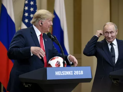 ﻿US President Donald Trump is presenetd with the official game ball of the FIFA World Cup 2018 from Russian President Vladimir Putin (R) during their joint press conference following their meeting at the Finnish Presidential Palace in Helsinki, Finland, 16 July 2018. Photo: Antti Aimo-Koivisto/Lehtikuva/dpa