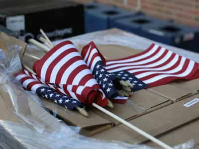 U.S. flags sit ahead Democratic presidential nominee U.S. Vice President Kamala Harris' night rally during the 2024 U.S. presidential election at Howard University, in Washington, U.S., November 5, 2024 REUTERS/Alyssa Pointer