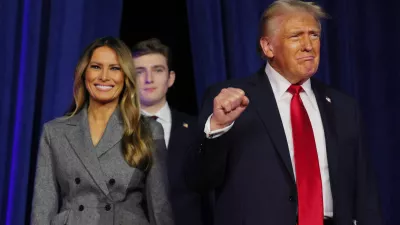 Republican presidential nominee and former U.S. President Donald Trump takes the stage with his wife Melania and son Barron to address supporters at his rally, at the Palm Beach County Convention Center in West Palm Beach, Florida, U.S., November 6, 2024. REUTERS/Brian Snyder