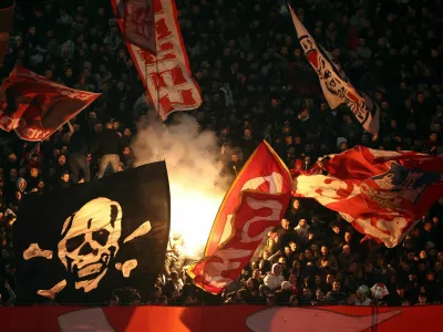 Soccer Football - Champions League - Crvena Zvezda v FC Barcelona - Rajko Mitic Stadium, Belgrade, Serbia - November 6, 2024 General view of Crvena Zvezda fans with flares in the stands REUTERS/Marko Djurica