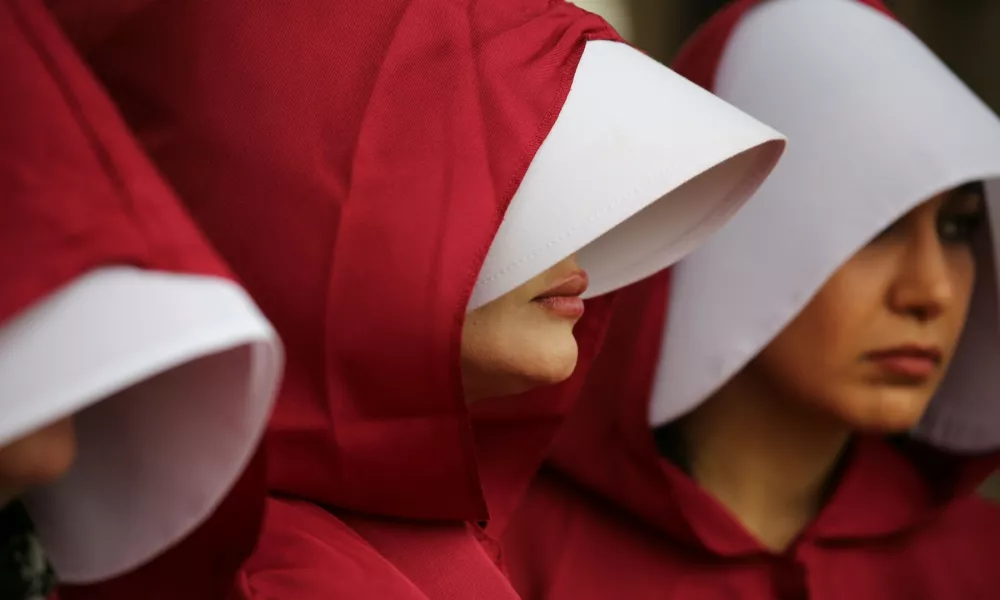 November 8, 2024, London, England, UK: Protesters dressed in Housemaid's Tale style costumes that allow only small parts of their faces to be visible meet in Parliament Square. Protesters wear costumes inspired by the Handmaid's Tale that are recognised as a symbol of female oppression faced by women of Iran. The protesters are also highlighting the plight of AHOO DARYAEI who stripped down to her underwear after being harassed by paramilitary forces for not wearing the hijab correctly on November 02 2024 she remains detained. This action has turned her into symbol of resistance against Iran's strict dress code laws.,Image: 931967737, License: Rights-managed, Restrictions:, Model Release: no / Foto: Martin Pope