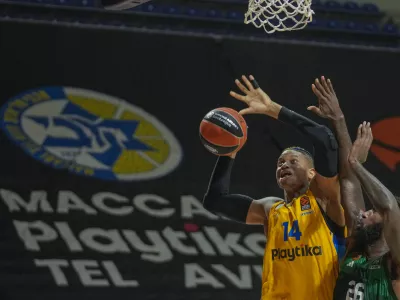 FILE - Maccabi's Jasiel Rivero, left, tries to score as Panathinaikos' Mathias Lessort blocks him during the Euroleague basketball match between Maccabi Tel Aviv and Panathinaikos in Belgrade, Serbia, Thursday, May 2, 2024. (AP Photo/Darko Vojinovic, File)