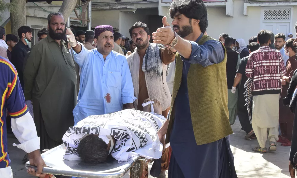 Relatives transport a bodies of the victim of a bomb explosion at railway station, after receiving from a hospital, in Quetta, southwestern Pakistan, Saturday, Nov. 9, 2024. (AP Photo/Arshad Butt)