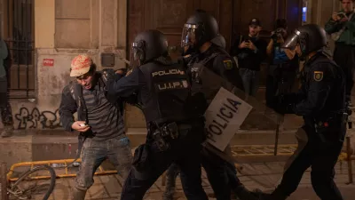 09 November 2024, Spain, Valencia: Police charge against a protester during clashes as demonstartors demand the resignation of of regional head Carlos Mazón over handling of recent deadly floods in Valencia. Photo: Elena Fernandez/ZUMA Press Wire/dpa