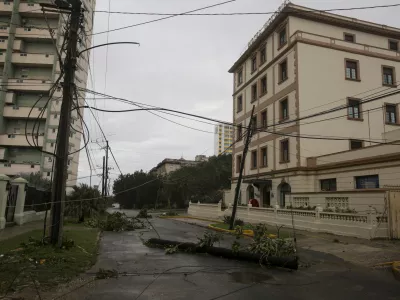 An electricity pole lies on a street after Hurricane Rafael passed through Havana, Thursday, Nov. 7, 2024. (AP Photo/Ariel Ley)