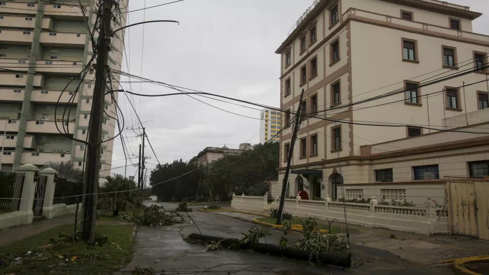 An electricity pole lies on a street after Hurricane Rafael passed through Havana, Thursday, Nov. 7, 2024. (AP Photo/Ariel Ley)