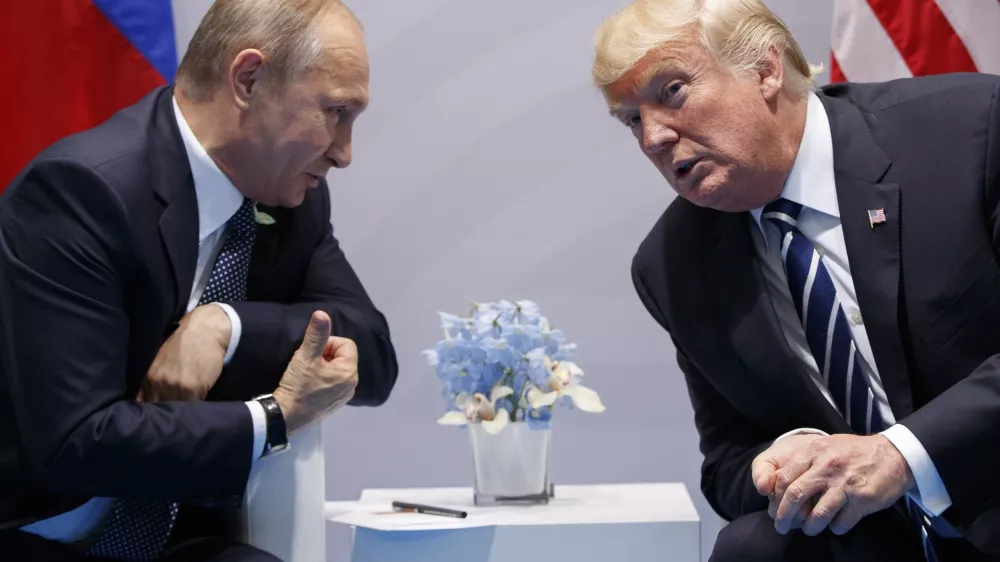 ﻿FILE - In this file photo taken on Friday, July 7, 2017, U.S. President Donald Trump, right, meets with Russian President Vladimir Putin at the G-20 Summit in Hamburg, Germany. The Kremlin said Trump called Putin to congratulate him on re-election, and White House press secretary Sarah Huckabee Sanders confirmed that Trump spoke with Putin Tuesday March 20, 2018. (AP Photo/Evan Vucci)