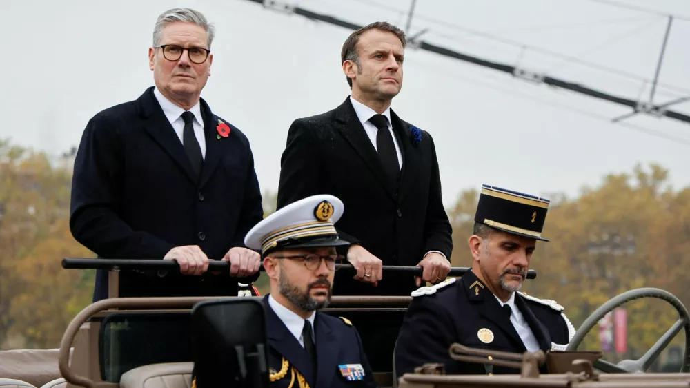 France's President Emmanuel Macron and Britain's Prime Minister Keir Starmer arrive at Place de l'Etoile to attend commemorations marking the 106th anniversary of the November 11, 1918, Armistice, ending World War I, in Paris, on November 11, 2024.   Ludovic Marin/Pool via REUTERS