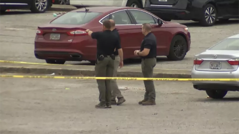 This image taken from video provided by WSFA shows law enforcement at the scene of a shooting at Tuskegee University, Sunday, Nov. 10, 2024, in Tuskegee, Ala. (WSFA via AP)