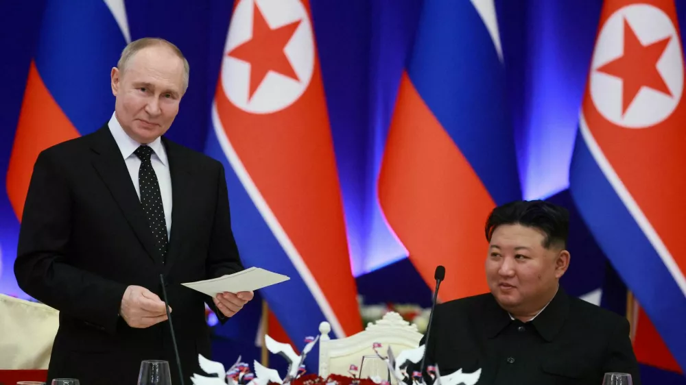 FILE PHOTO: Russia's President Vladimir Putin and North Korea's leader Kim Jong Un attend a state reception in Pyongyang, North Korea June 19, 2024. Sputnik/Vladimir Smirnov/Pool via REUTERS ATTENTION EDITORS - THIS IMAGE WAS PROVIDED BY A THIRD PARTY./File Photo