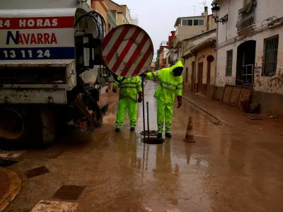 Workers clean a drainage system blocked by mud following catastrophic flooding, as Spain braces for torrential rain, in Paiporta, Valencia, November 13, 2024. REUTERS/Vincent West