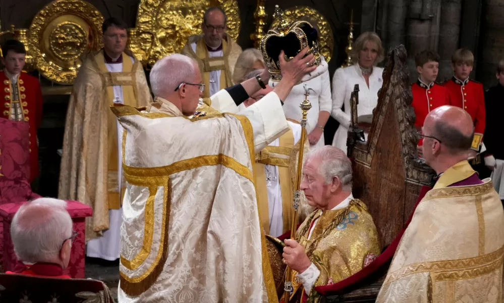 FILE PHOTO: King Charles III is crowned with St Edward's Crown by The Archbishop of Canterbury the Most Reverend Justin Welby during his coronation ceremony in Westminster Abbey, London. Picture date: Saturday May 6, 2023.  Victoria Jones/Pool via REUTERS/File Photo