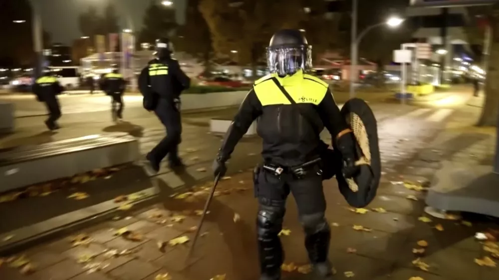 In this image taken from video, police officers patrol in riot gear on the streets of Amsterdam, Monday Nov. 11, 2024, as the city is facing tensions following violence last week. (AP Photo)