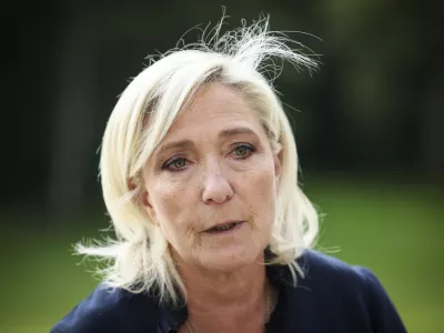 FILE - French far-right leader Marine Le Pen answers reporters at the Elysee Palace after a meeting with French President Emmanuel Macron, Aug. 26, 2024 in Paris. (AP Photo/Thomas Padilla, File)