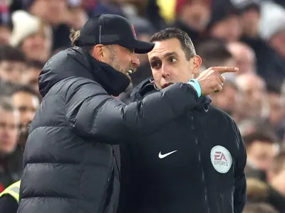 FILE PHOTO: Soccer - Juergen Klopp remonstrates with fourth official David Coote during Liverpool's Premier League match against Everton. Anfield, Liverpool, Britain - February 13, 2023. REUTERS/Carl Recine EDITORIAL USE ONLY. No use with unauthorized audio, video, data, fixture lists, club/league logos or 'live' services. Online in-match use limited to 75 images, no video emulation. No use in betting, games or single club /league/player publications. Please contact your account representative for further details./File Photo