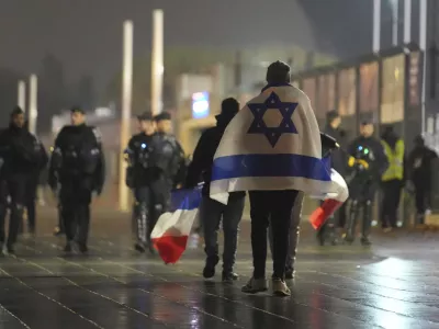 Soccer supporters leave after the Nations League soccer match France against Israel outside the Stade de France stadium, Thursday, Nov. 14, 2024 in Saint-Denis, outside Paris. (AP Photo/Christophe Ena)