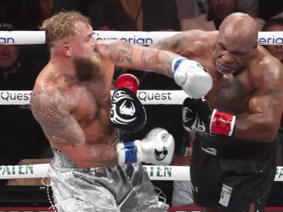 Nov 15, 2024; Arlington, Texas, UNITED STATES; Mike Tyson (black gloves) fights Jake Paul (silver gloves) at AT&T Stadium. Mandatory Credit: Kevin Jairaj-Imagn Images